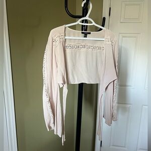Beige detailed front tie up top. Flared long sleeves, size M from forever 21.